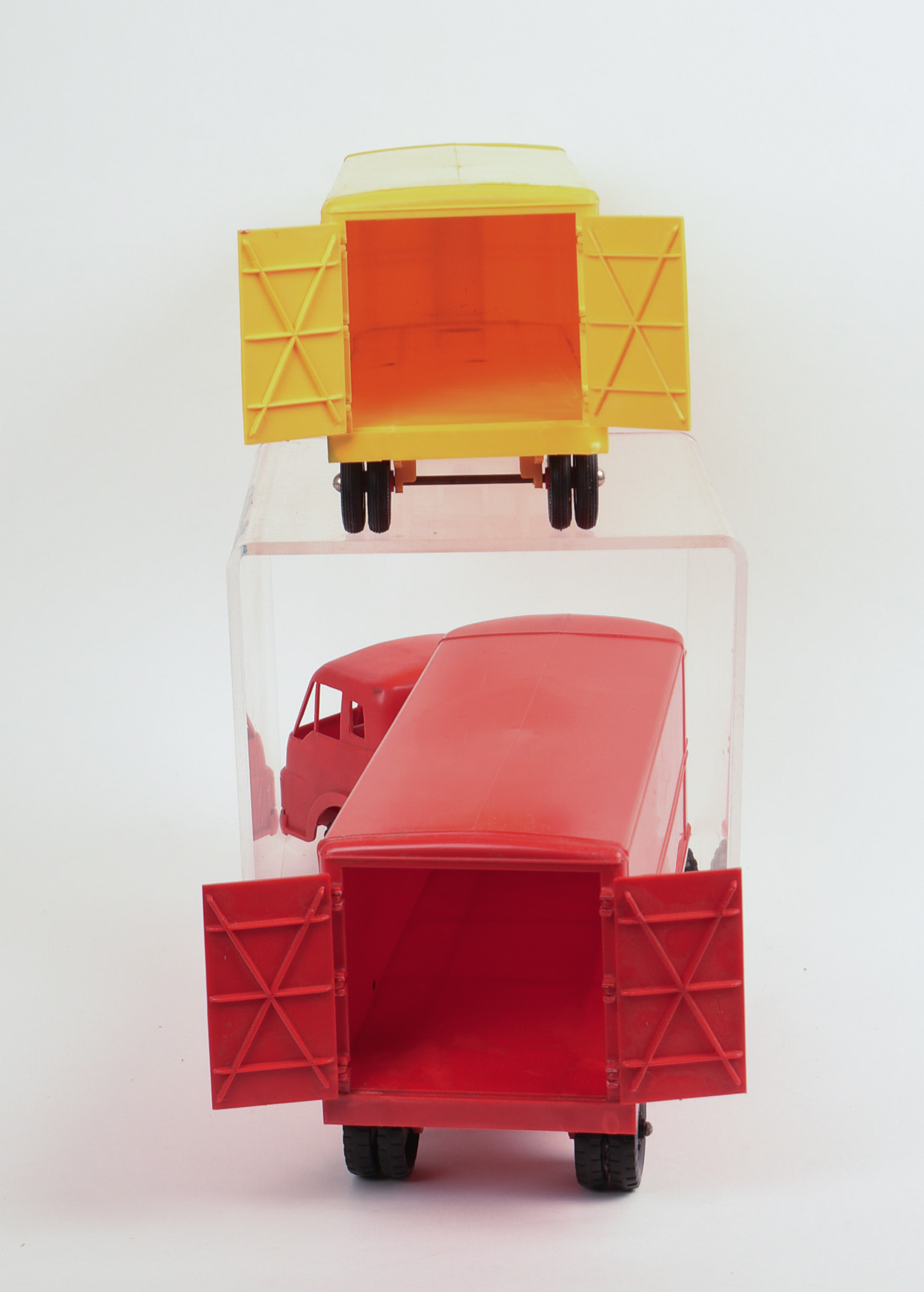 Two International Toy Trucks and a Trailer.