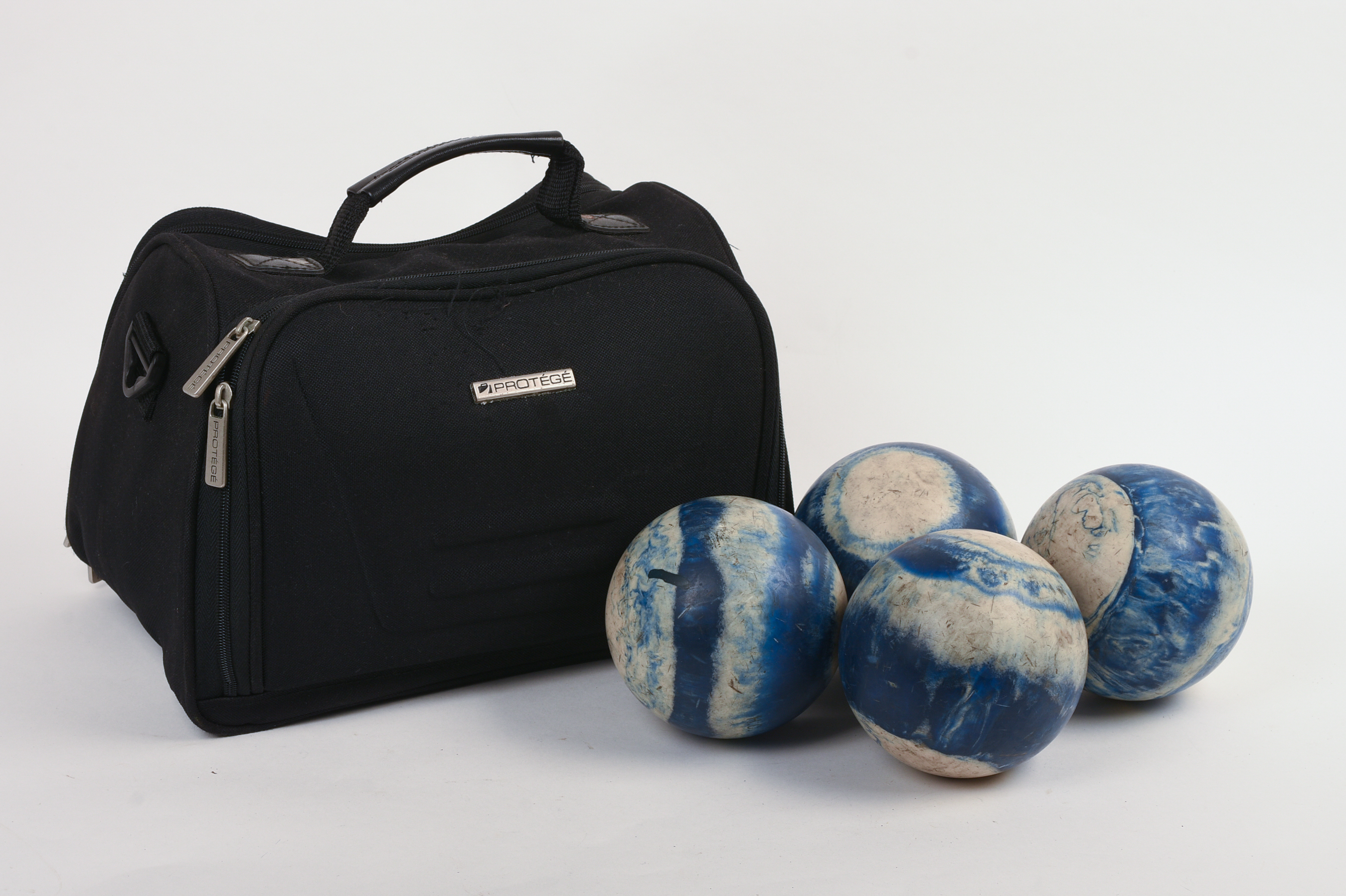 FOUR CANDLEPIN BOWLING BALLS.