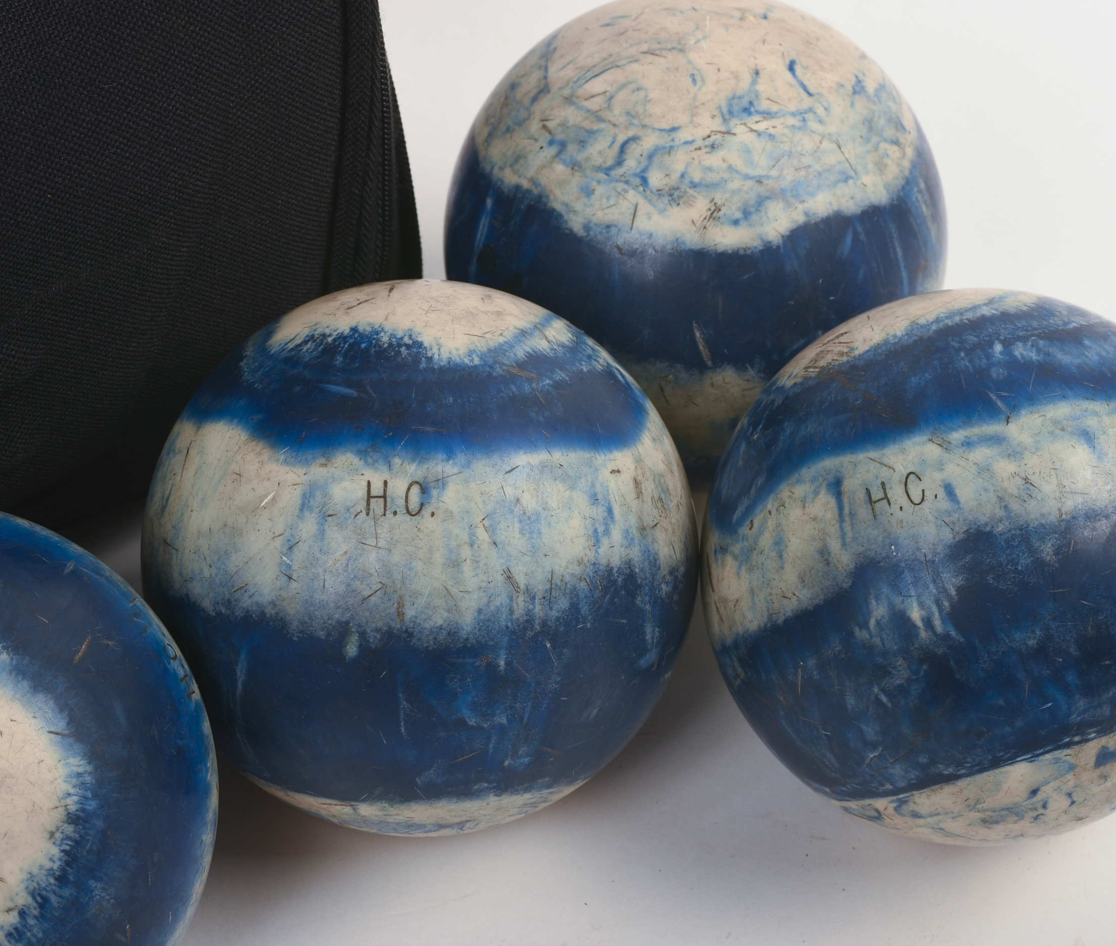 FOUR CANDLEPIN BOWLING BALLS.