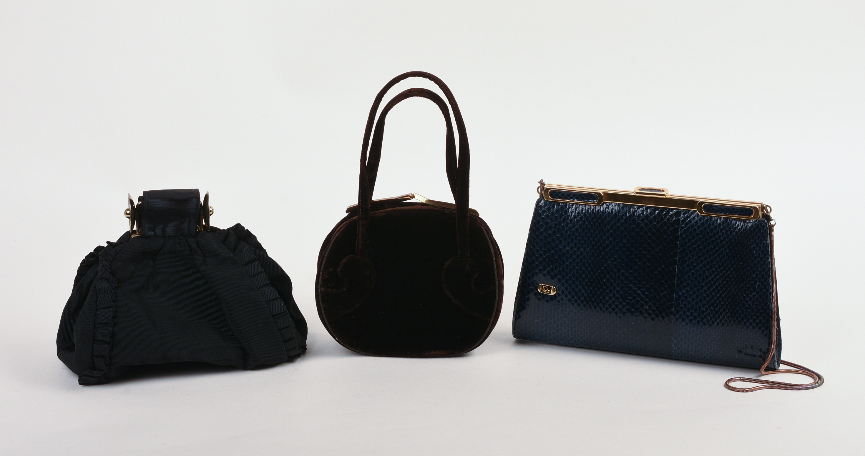 THREE DESIGNER CLUTCHES.