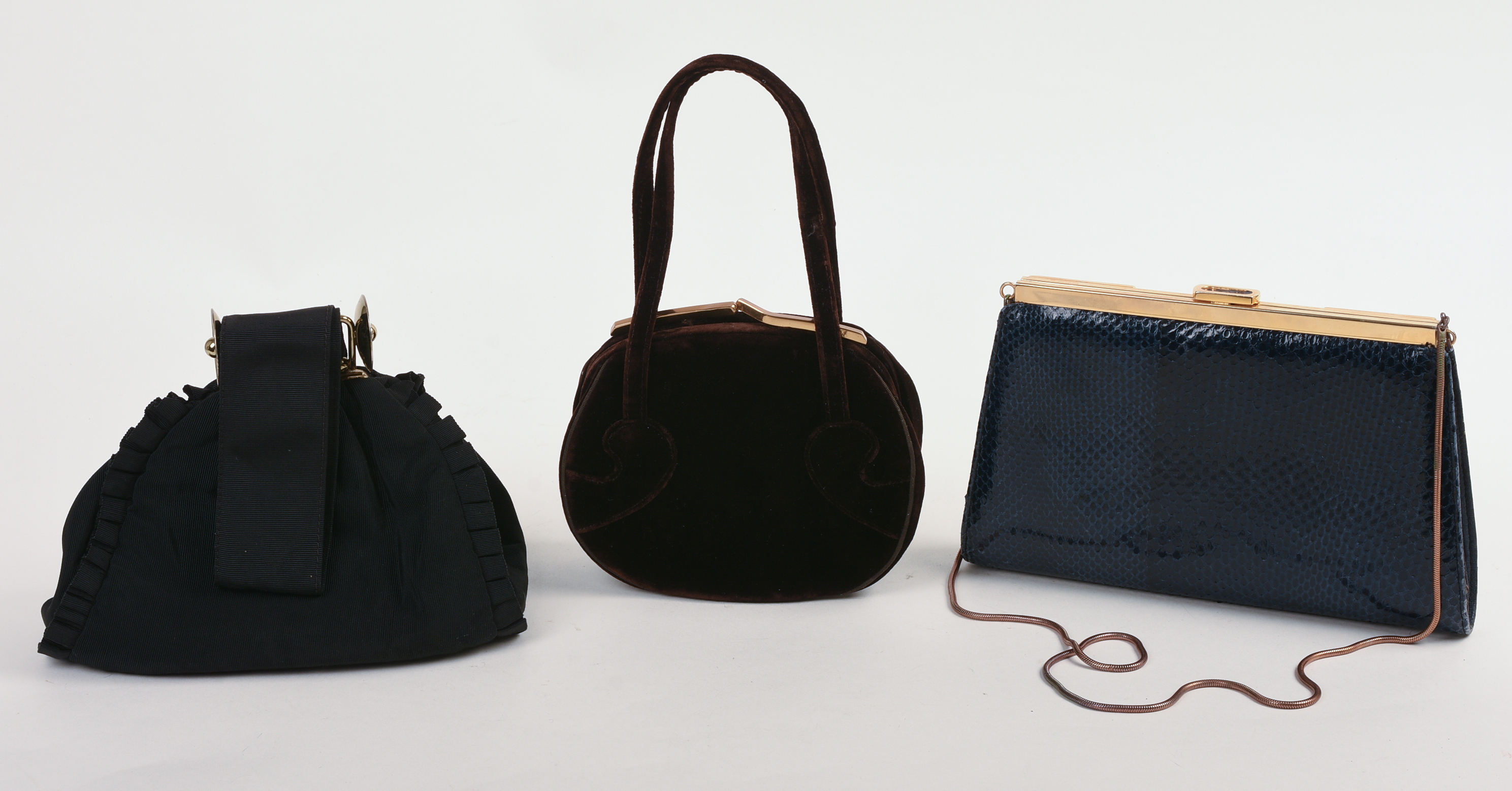 THREE DESIGNER CLUTCHES.