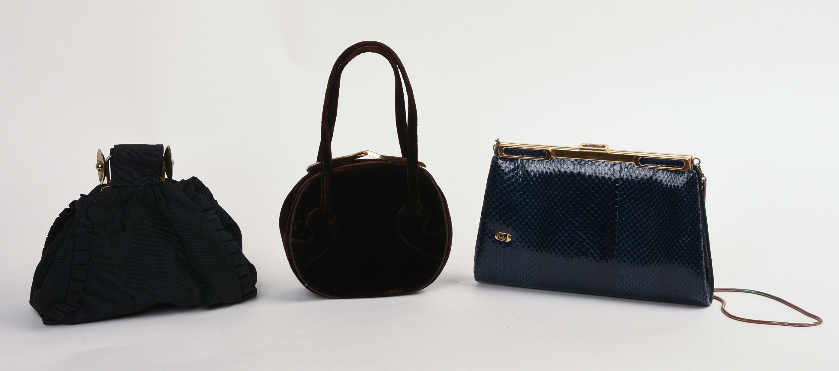 THREE DESIGNER CLUTCHES.