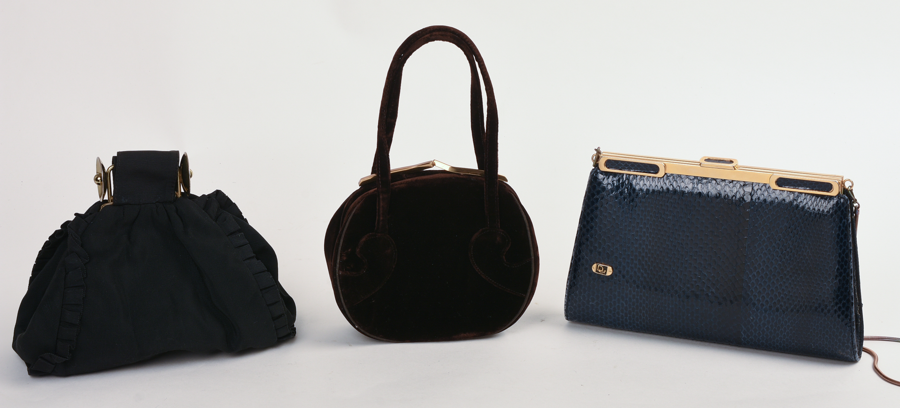THREE DESIGNER CLUTCHES.