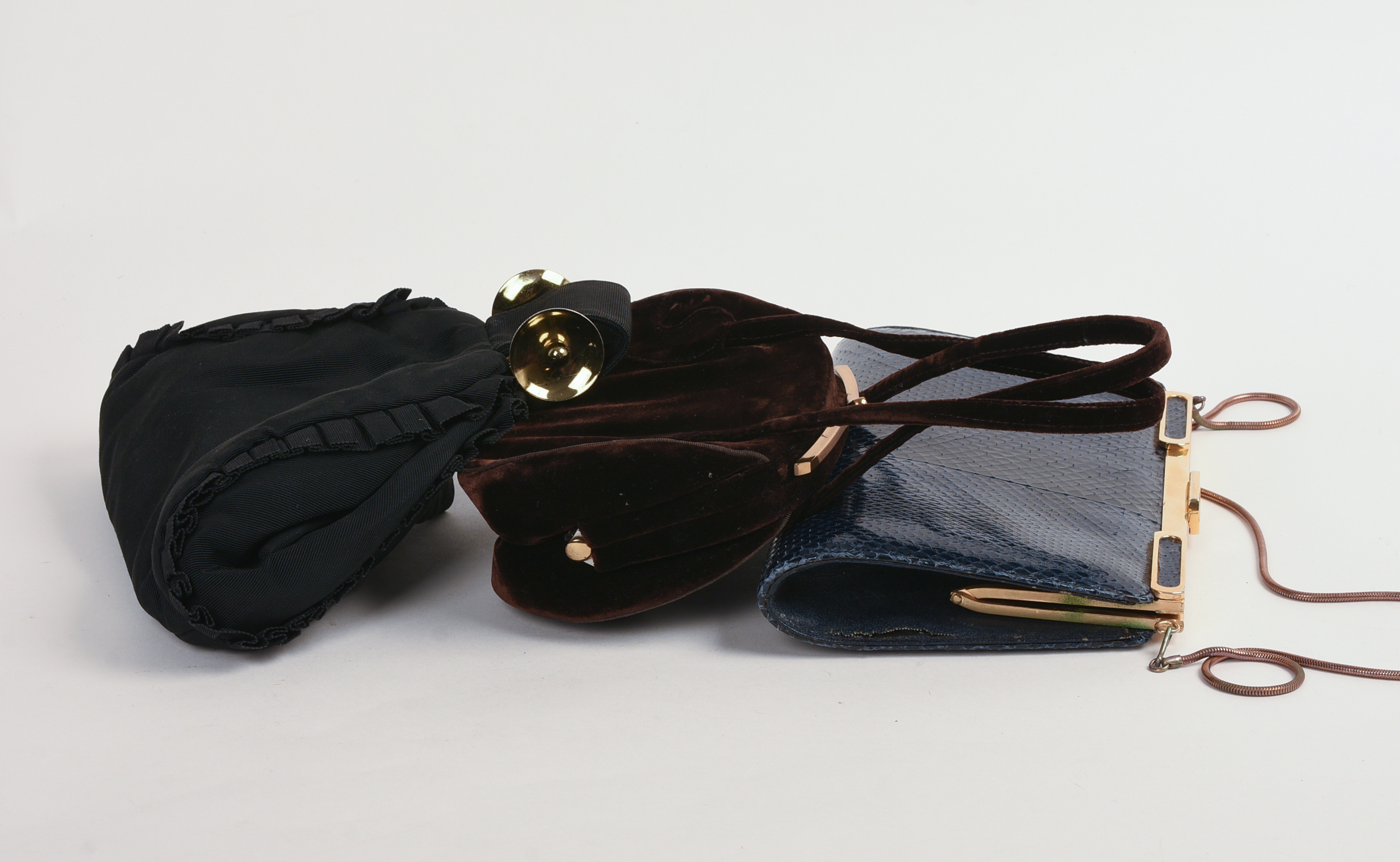 THREE DESIGNER CLUTCHES.