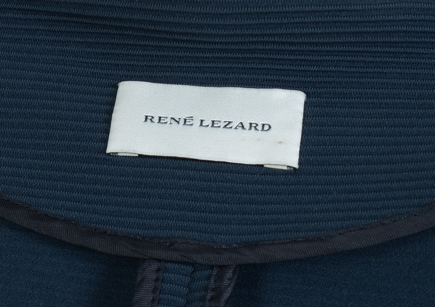 PIAZZA SEMPIONE BLAZER AND A RENE LEZARD BLOUSE.
