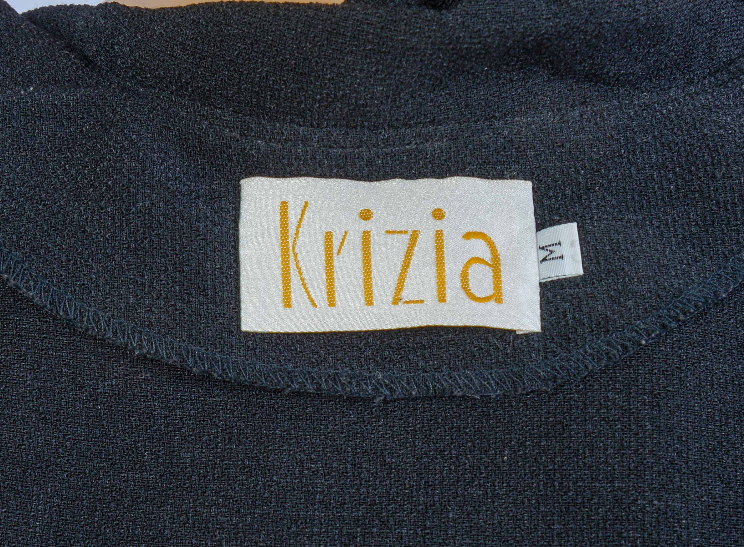 KRIZIA JACKET, SIZE 48, AND A TOP, SIZE M.