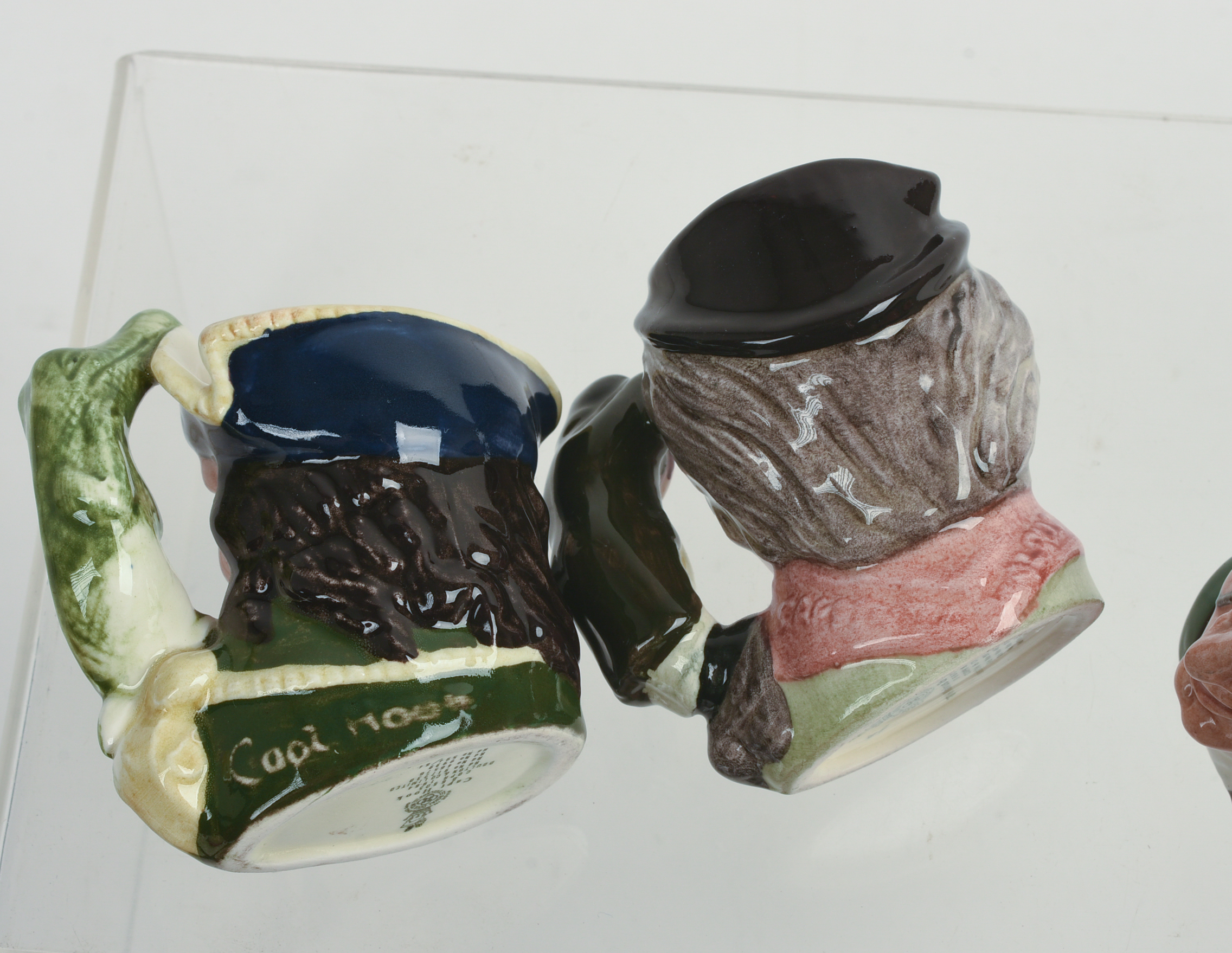 Eight Miniature Royal Doulton Character Pitchers.