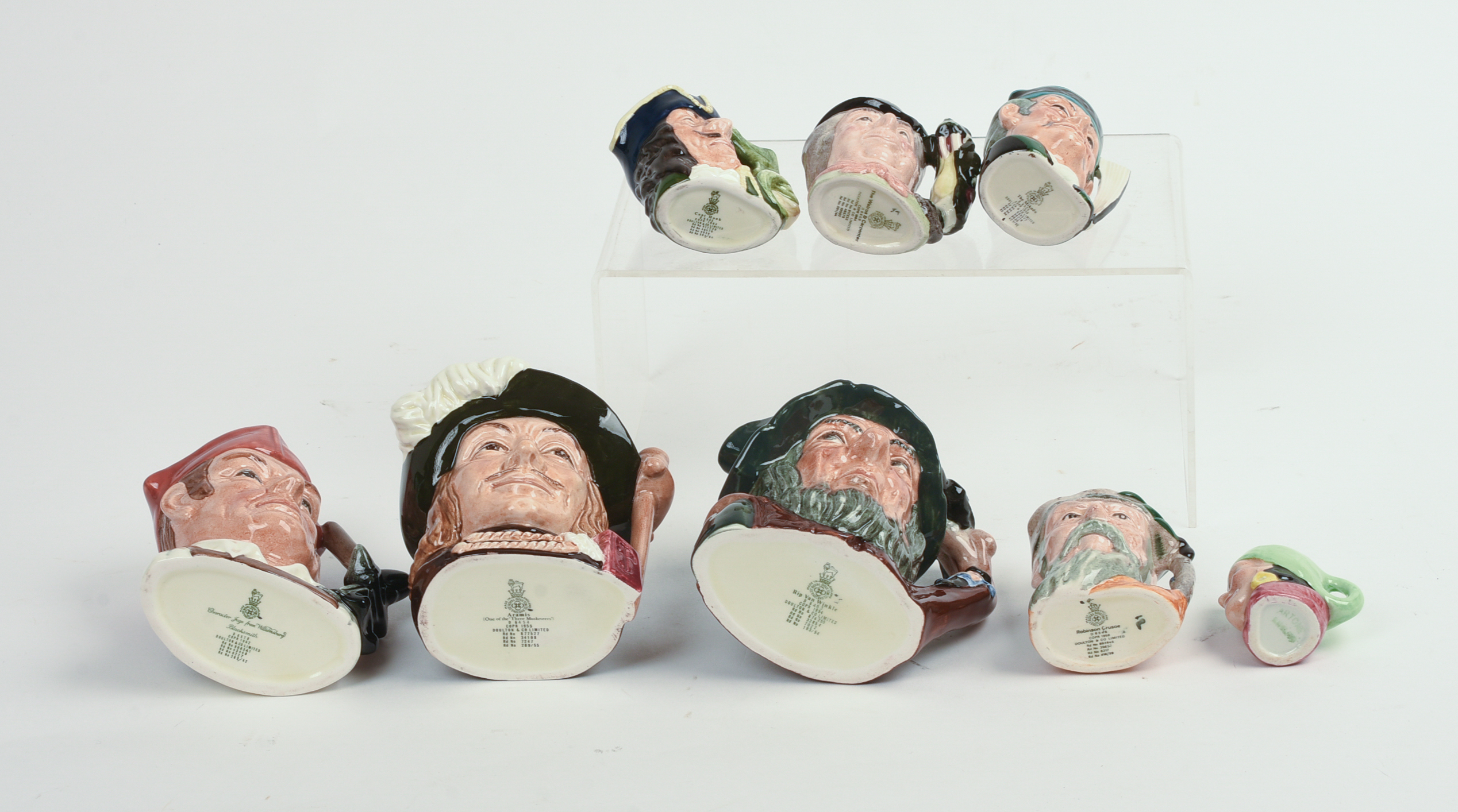 Eight Miniature Royal Doulton Character Pitchers.