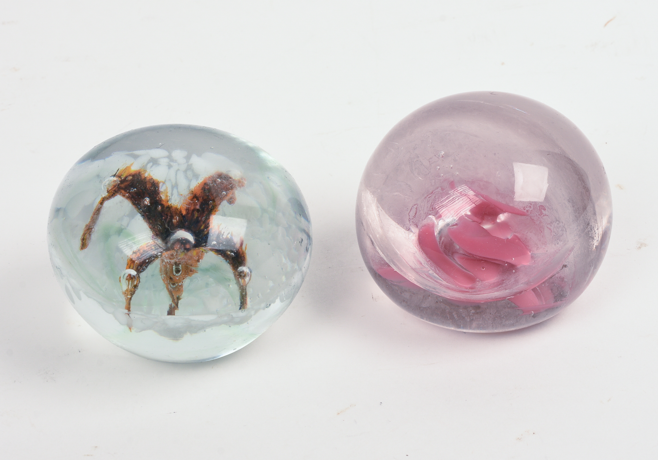 Two Glass Paperweights.