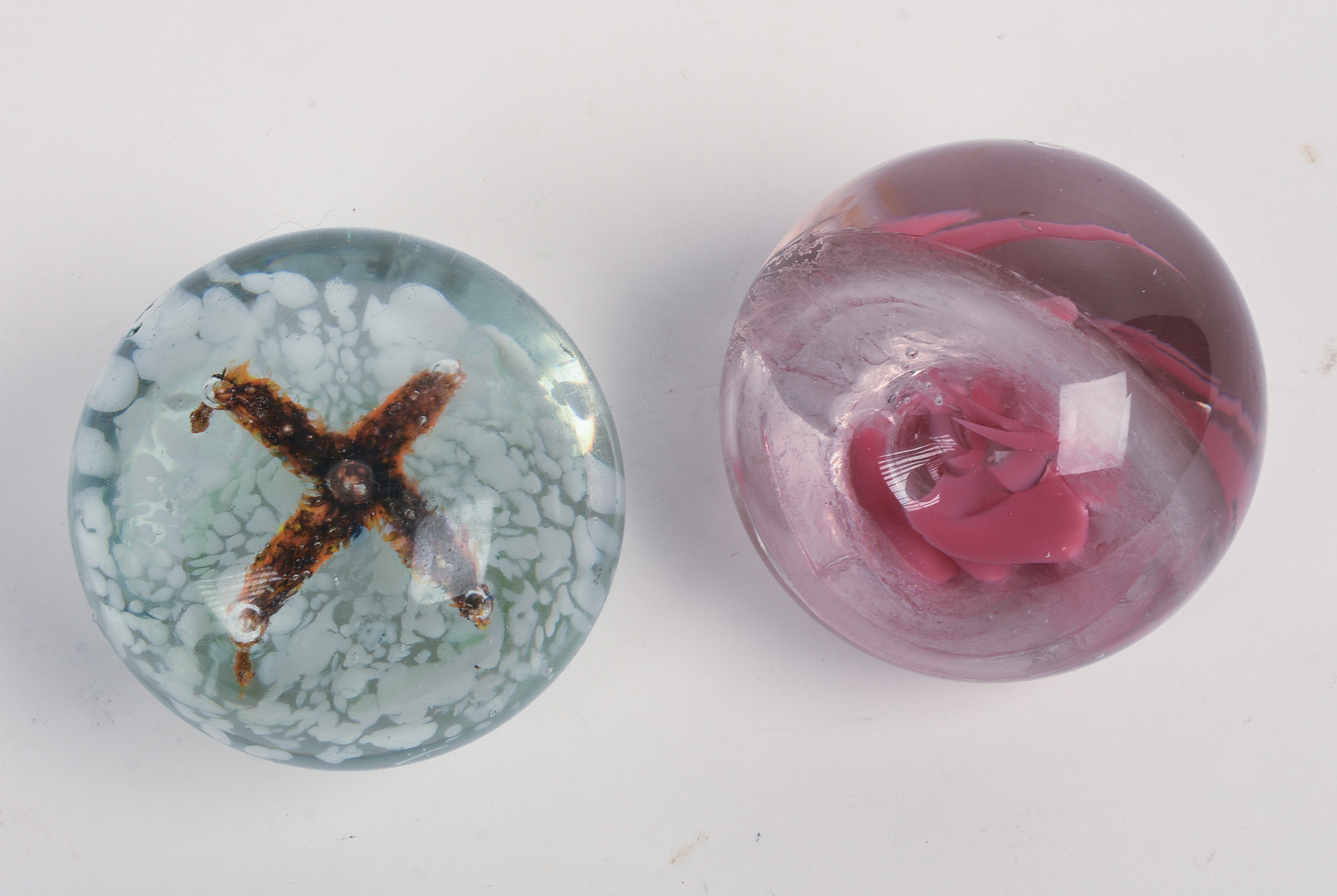 Two Glass Paperweights.