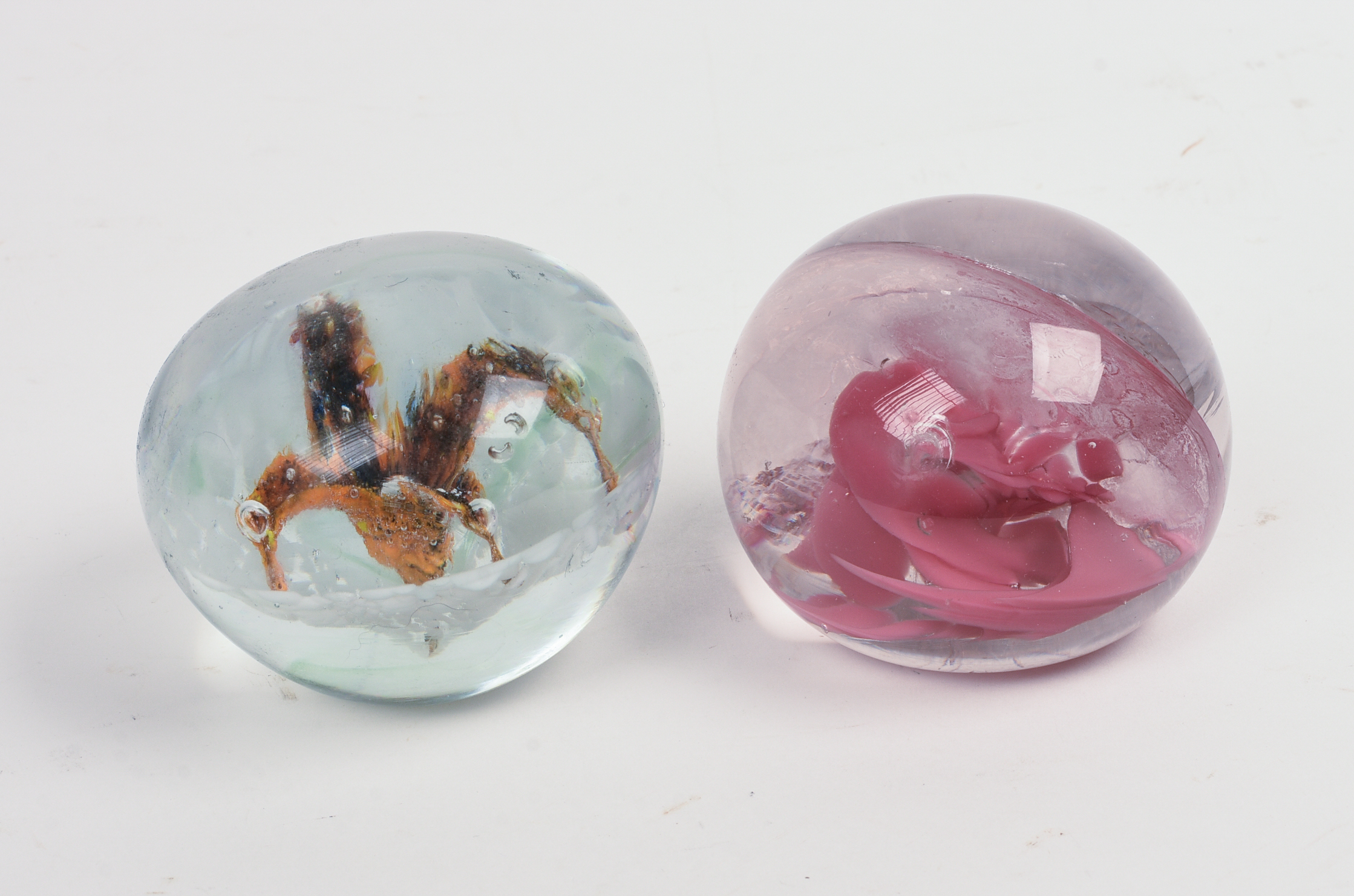 Two Glass Paperweights.