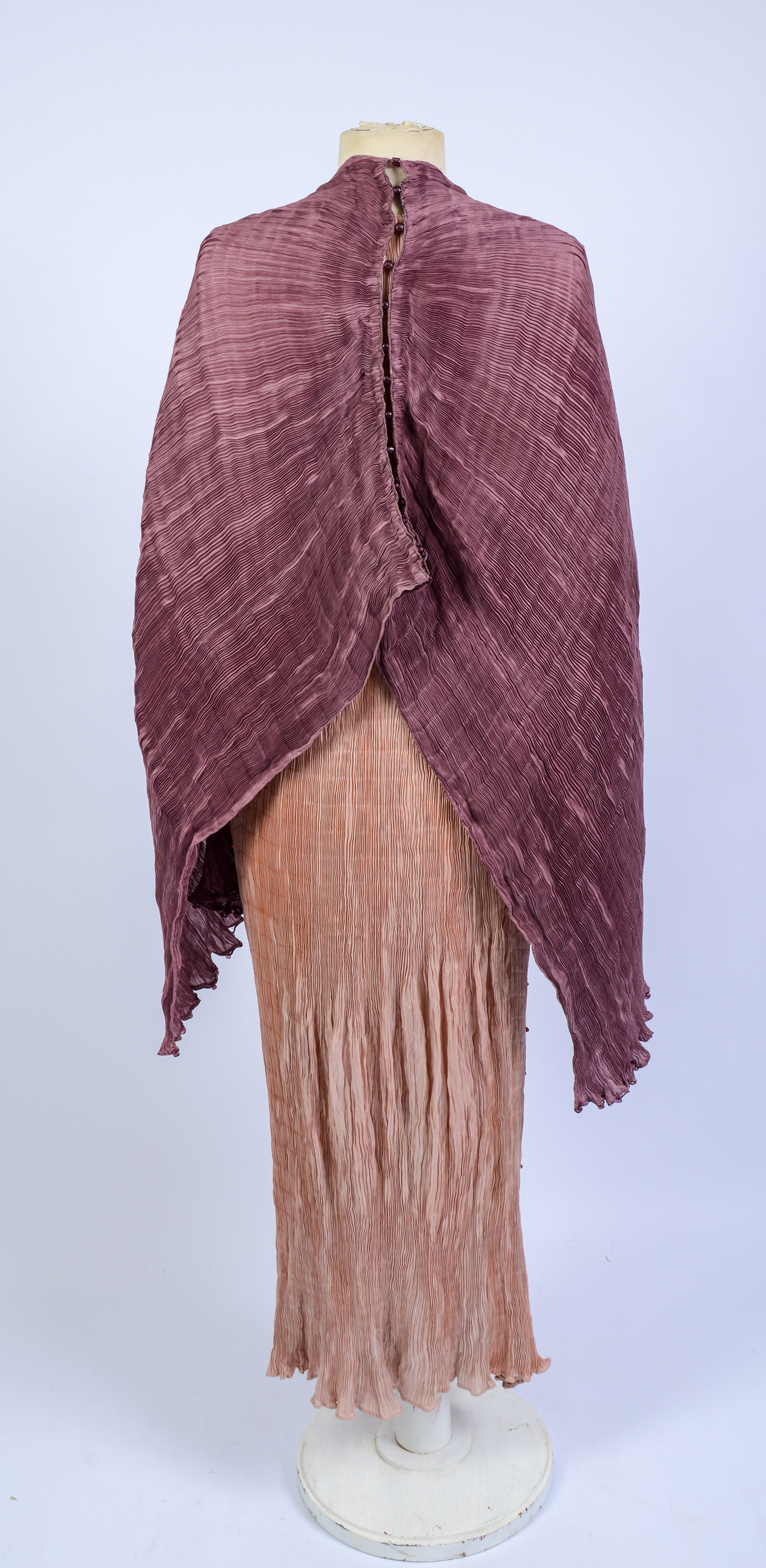 FORTUNY DELPHOS GOWN AND A SHAWL.