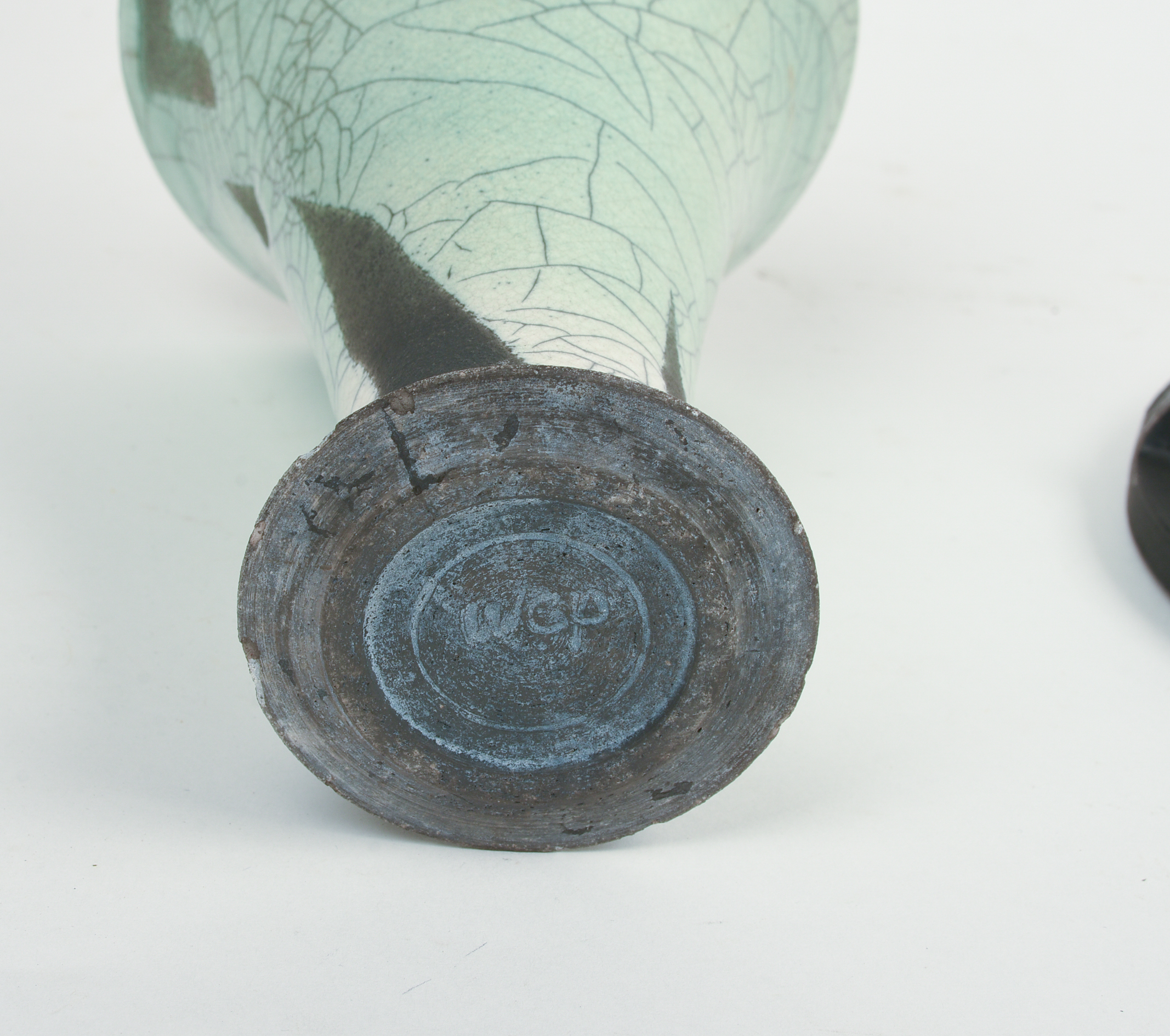 STUDIO POTTERY VASE WITH WROUGHT IRON CANDLESTICKS.
