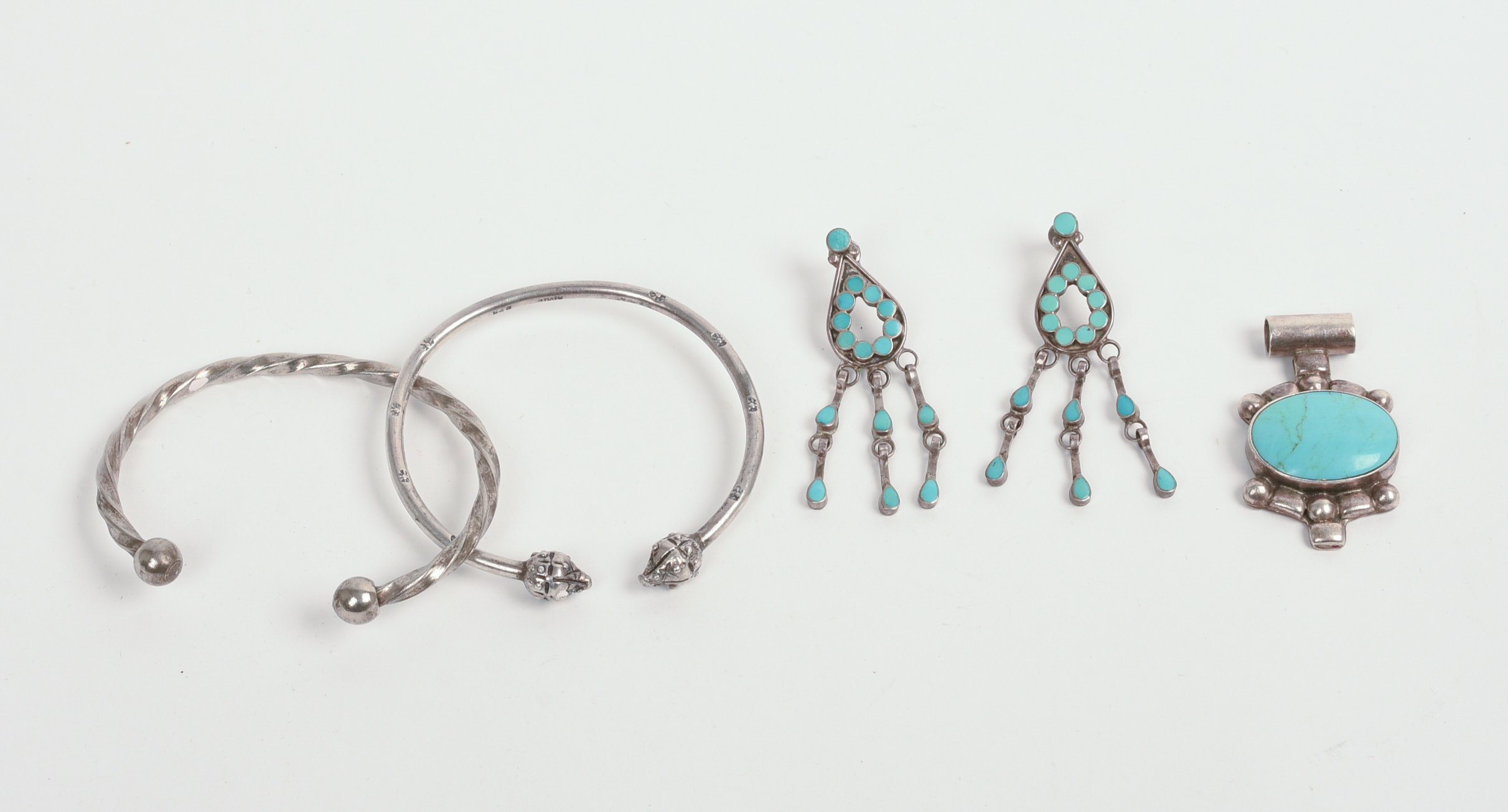 TWO BRACELETS AND A TURQUOISE BROOCH AND EARRINGS.