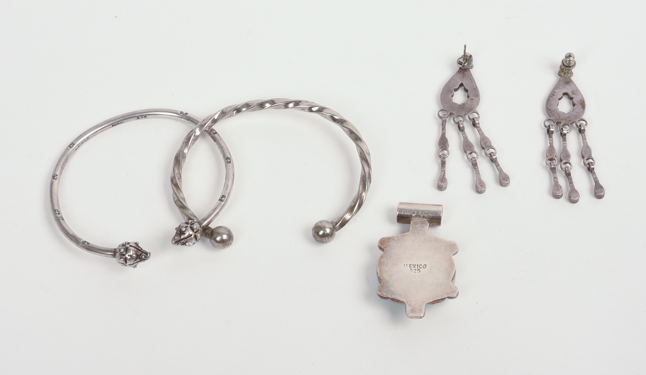 TWO BRACELETS AND A TURQUOISE BROOCH AND EARRINGS.