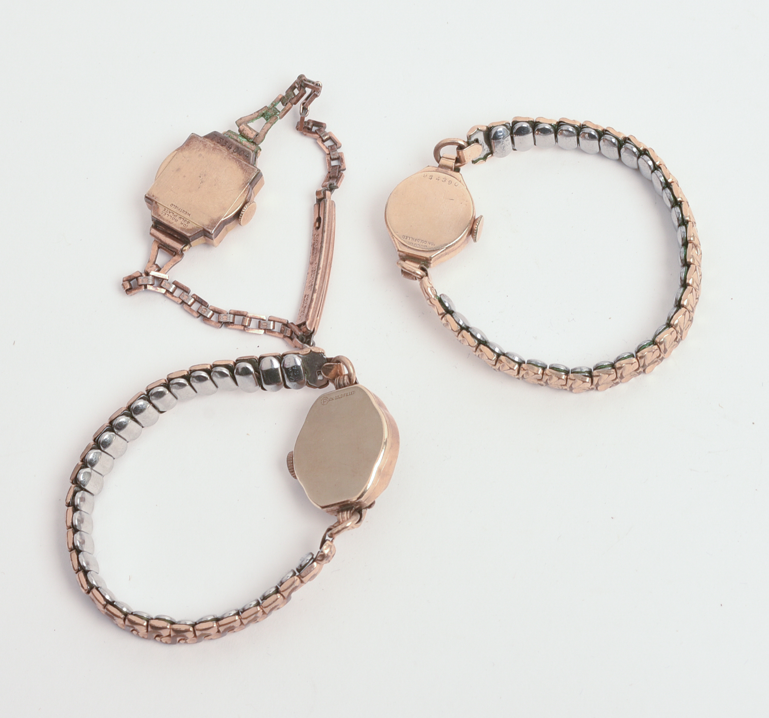 THREE ROLLED GOLD LADIES WATCHES.