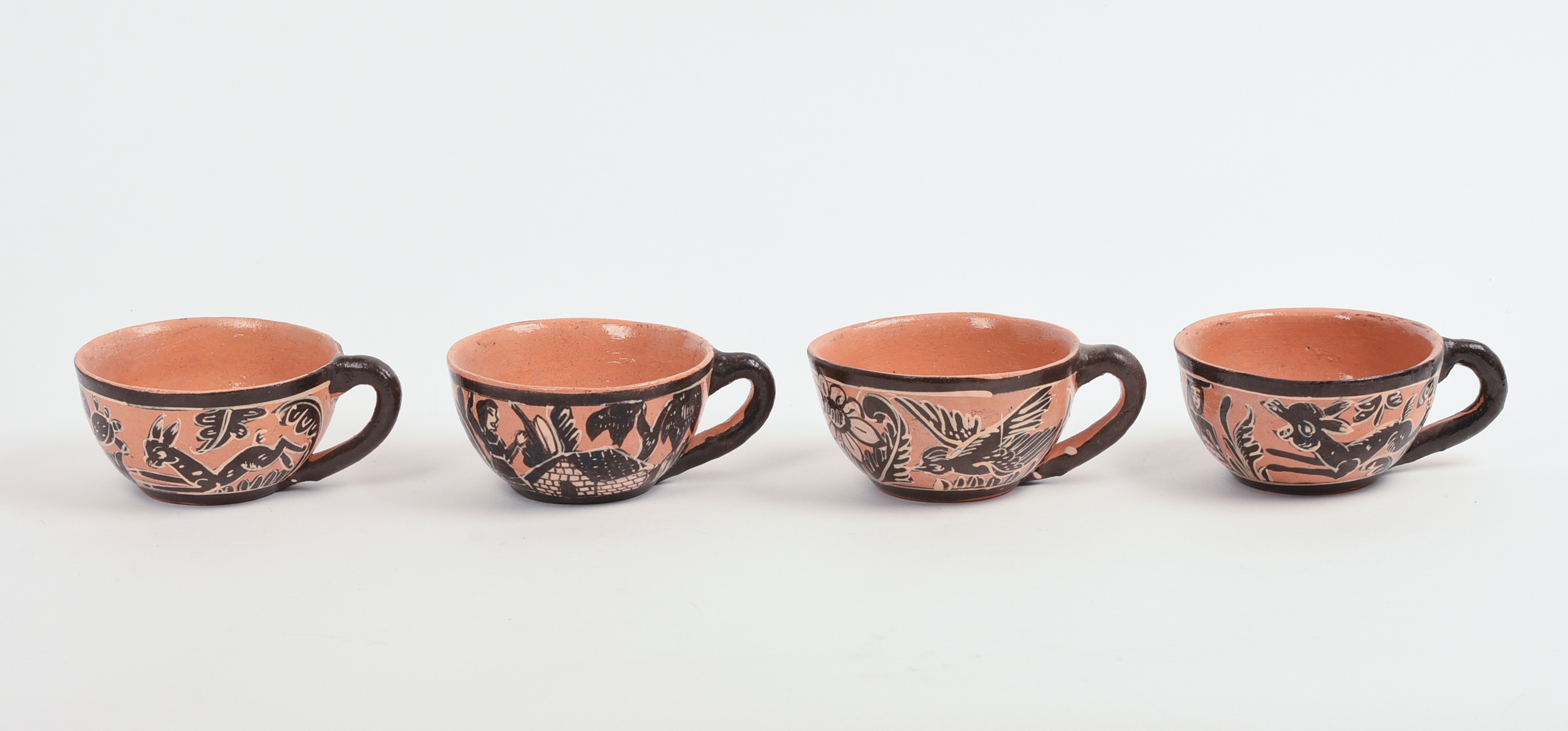 FOUR MEXICAN TLAQUEPAQUE POTTERY CUPS