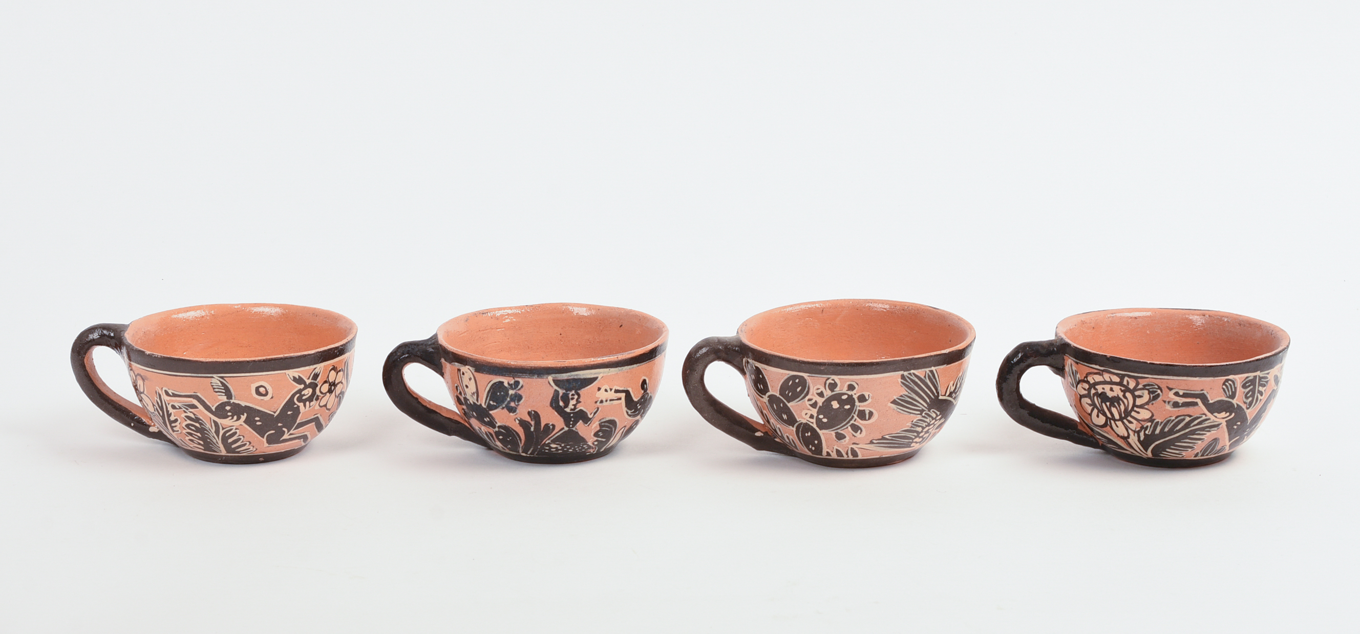 FOUR MEXICAN TLAQUEPAQUE POTTERY CUPS