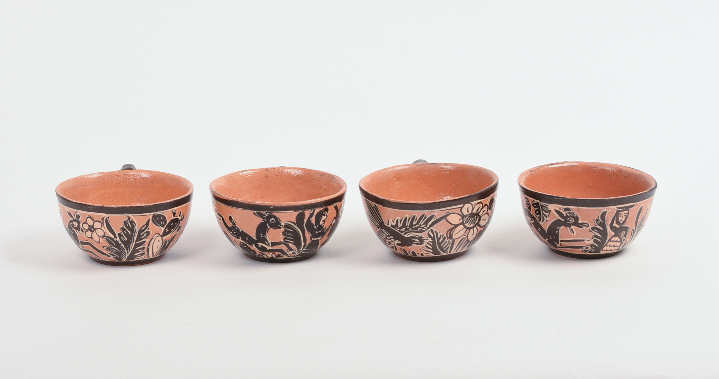 FOUR MEXICAN TLAQUEPAQUE POTTERY CUPS