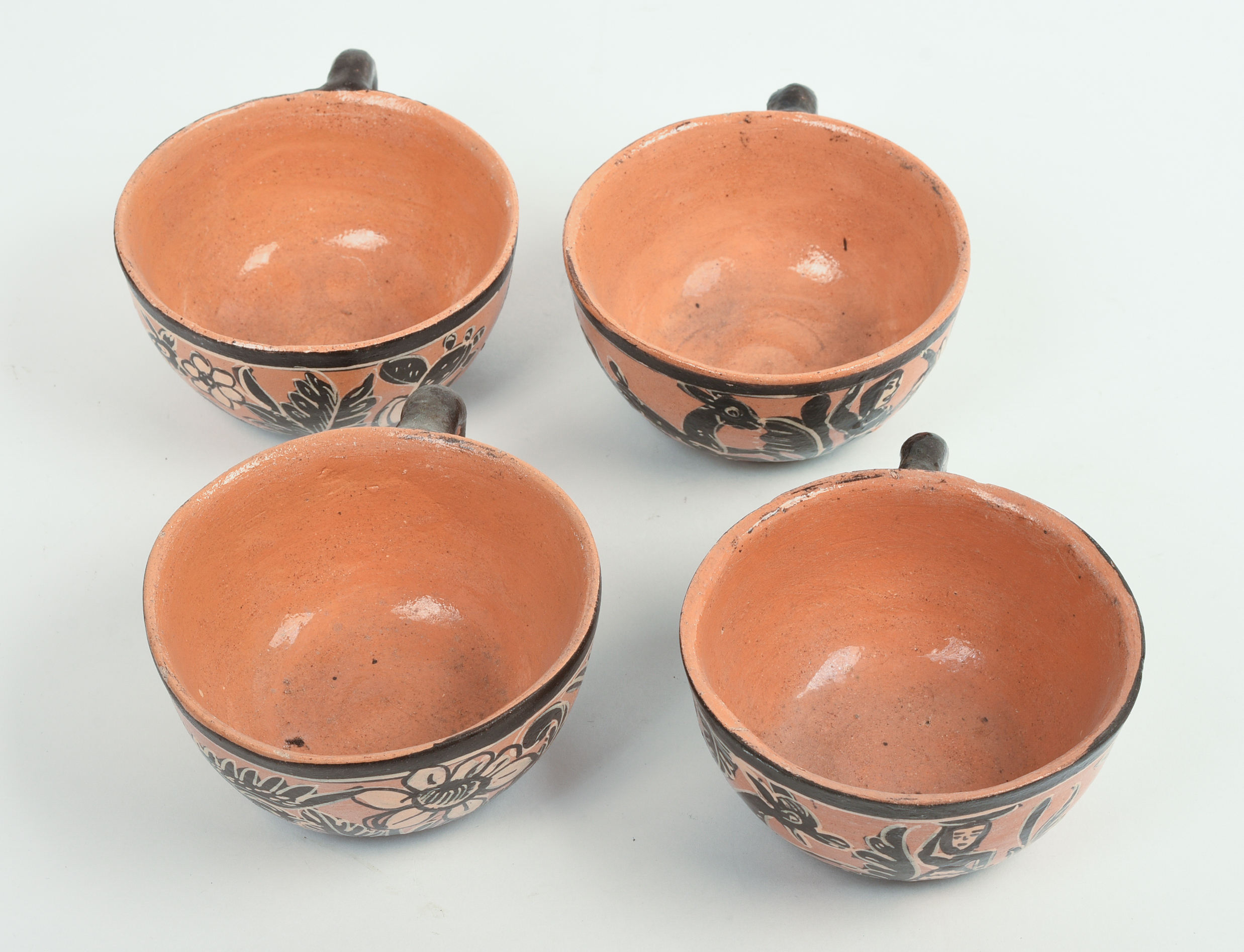 FOUR MEXICAN TLAQUEPAQUE POTTERY CUPS