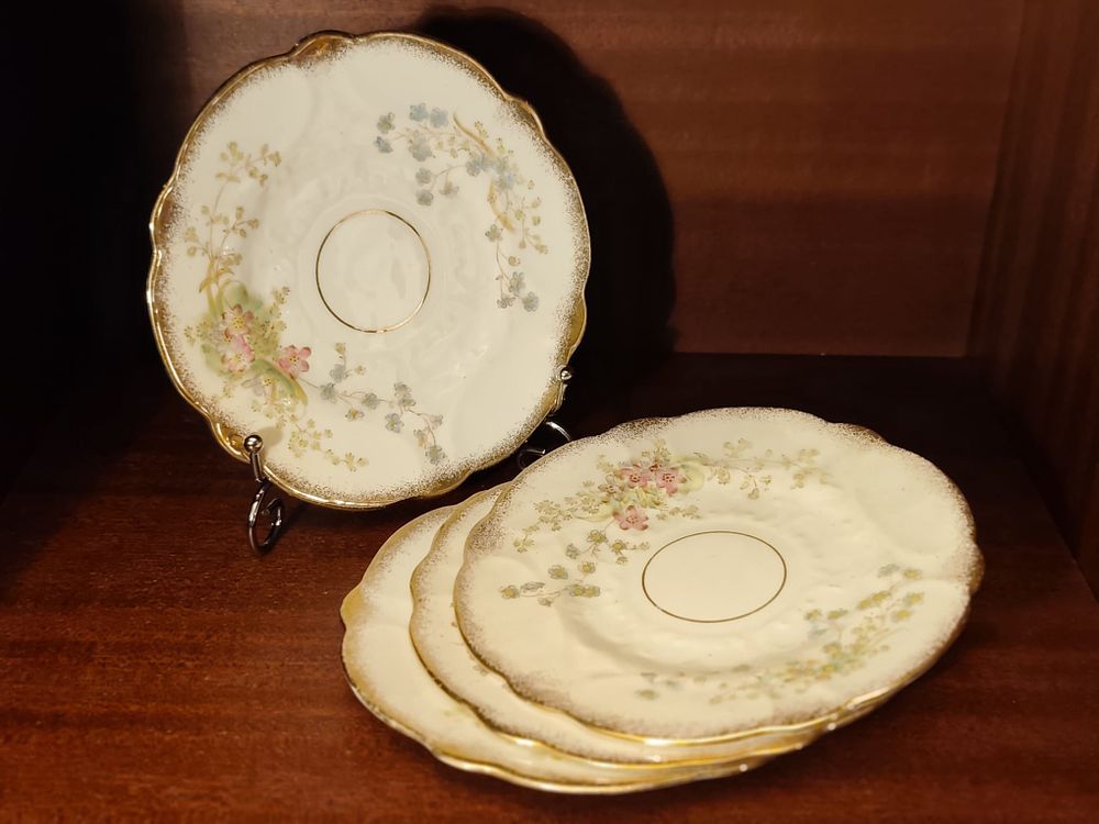 Vintage four fine bone china saucers.