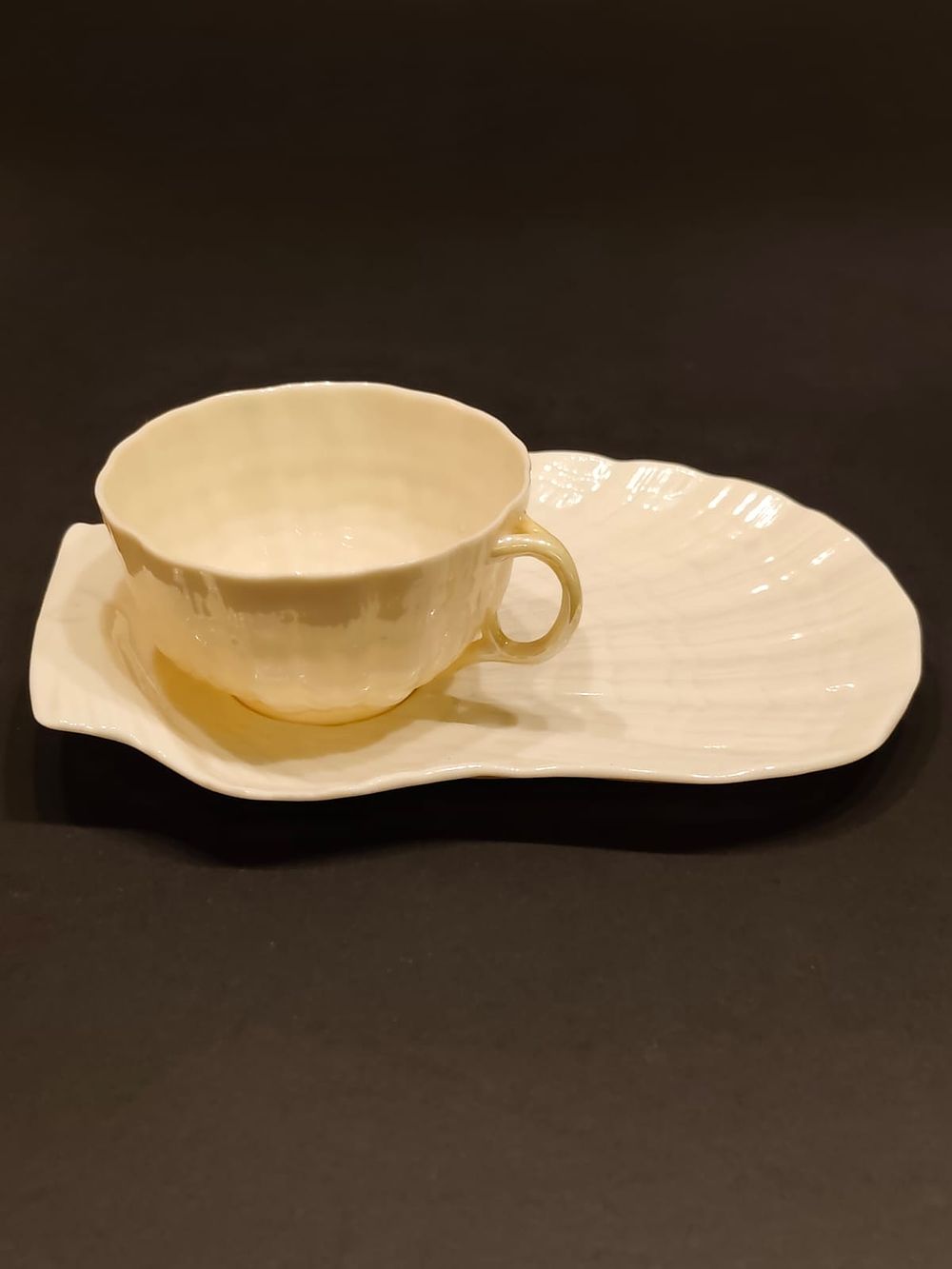 Belleek 6th period cup and unmarked saucer, Oyster pattern. Green Mark (1965-1980) cup and 