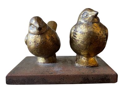 A Pair of Stylized Gilt Metal Birds on a Cast Iron Base. 5 x 3.5 A decorative figural sculpture 