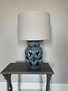A Teal-Glazed Ceramic Openwork Lattice Table Lamp. 13 x 22 
A table lamp featuring a vase-shaped Image - 1