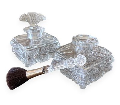A Three-Piece Late 19th to Early 20th Century Cut Glass Vanity Set. This lot comprises two 