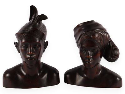 A Pair of Hand Carved Balinese Wood Man and Woman Busts. A pair of hand-carved dark 