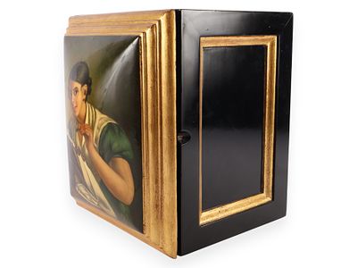 Black Wooden Cabinet with The Lacemaker Painting. A black wooden cabinet with a gold-colored 