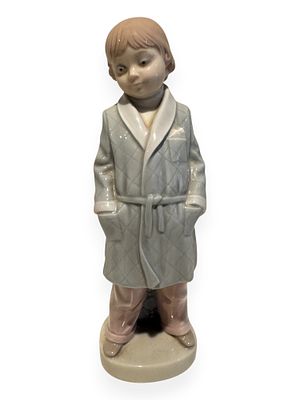 Lladro 'Boy With Robe' Figurine, Model 4900. A Lladro porcelain figurine titled 'Boy With Robe' 