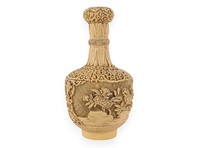 Chinese Carved Resin Vase with Floral and Scroll Motifs. A Chinese carved resin vase, crafted 