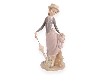 Lladro 'Young Lady in Trouble' Porcelain Figurine, No. 4912. A Lladro porcelain figurine titled 