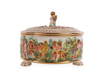 Capodimonte Porcelain Footed Covered Box with Putti Decoration, Italy. A Capodimonte porcelain 