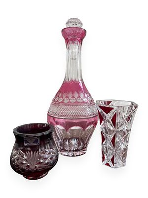 Three Godinger Cranberry Cut to Clear Crystal Vessels. A group of three modern cranberry cut to 