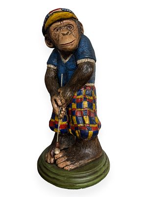 A Progressive Art Products Chalkware Chimpanzee Golfer Figurine, circa 1970s. A hand-painted 
