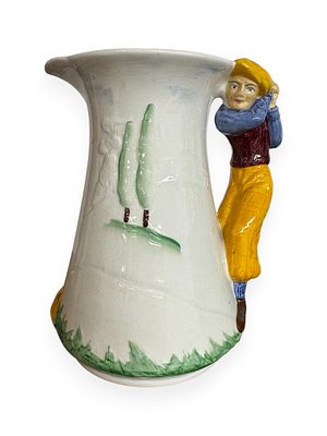 A Burleigh Ware 'Golfer' Ironstone Jug of figural form, featuring a golfer in a yellow cap and 