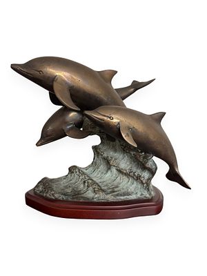 San Pacific International (SPI) Bronze Sculpture of Three Dolphins. A bronze sculpture by San 