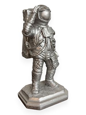 Silver-Toned Astronaut Figurine, Made in U.S.A. A silver-toned astronaut figurine, depicting a 