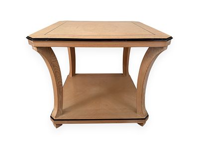 An Art Deco Style Two-Tiered Side Table. Constructed from light-toned wood, the table features 