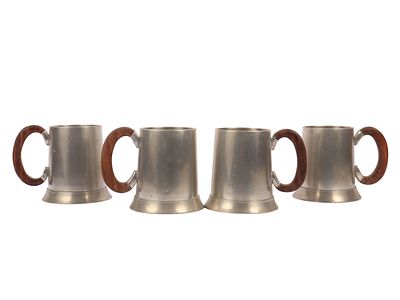 A Set of Four Indonesian Banka Tin Modernist Tankards with Wooden Handles. A set of four 