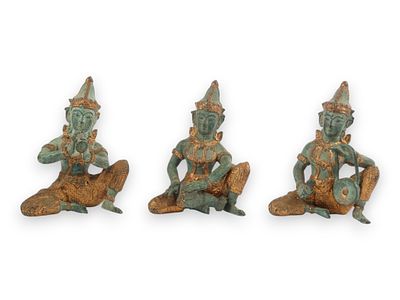 A Trio of Thai Gilt Brass Teppanom Musician Figures. A set of three seated musician figurines 