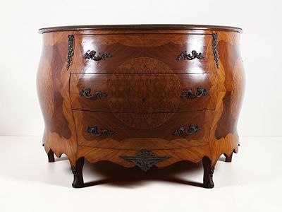 A Louis XV Style Marquetry Bomb&eacute; Commode. A Louis XV style bomb&eacute; commode featuring a 
