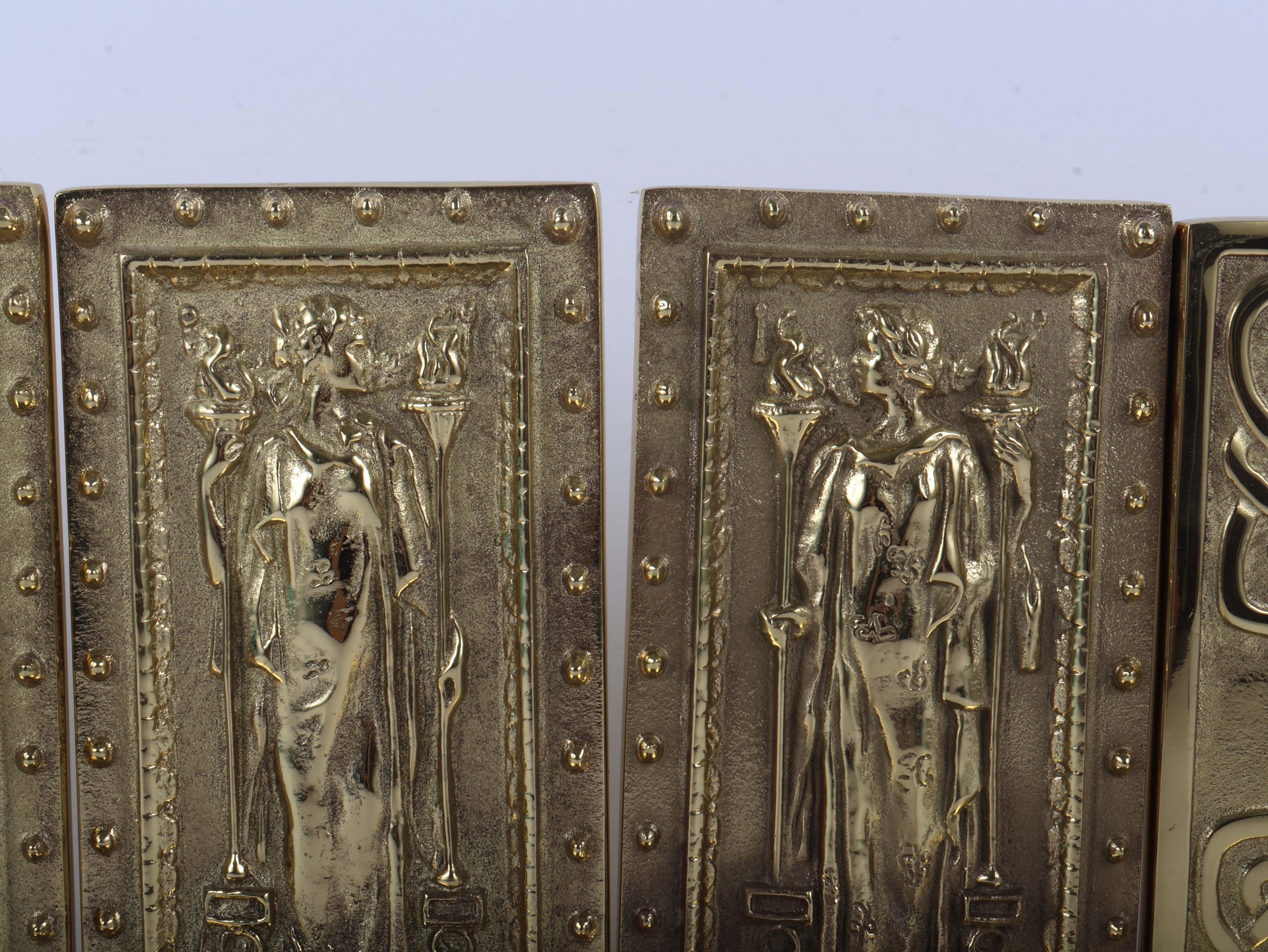 A Set of Virginia Metalcrafters Polished Solid Brass Bookends Including Library of Congress and Celtic Knot Patterns