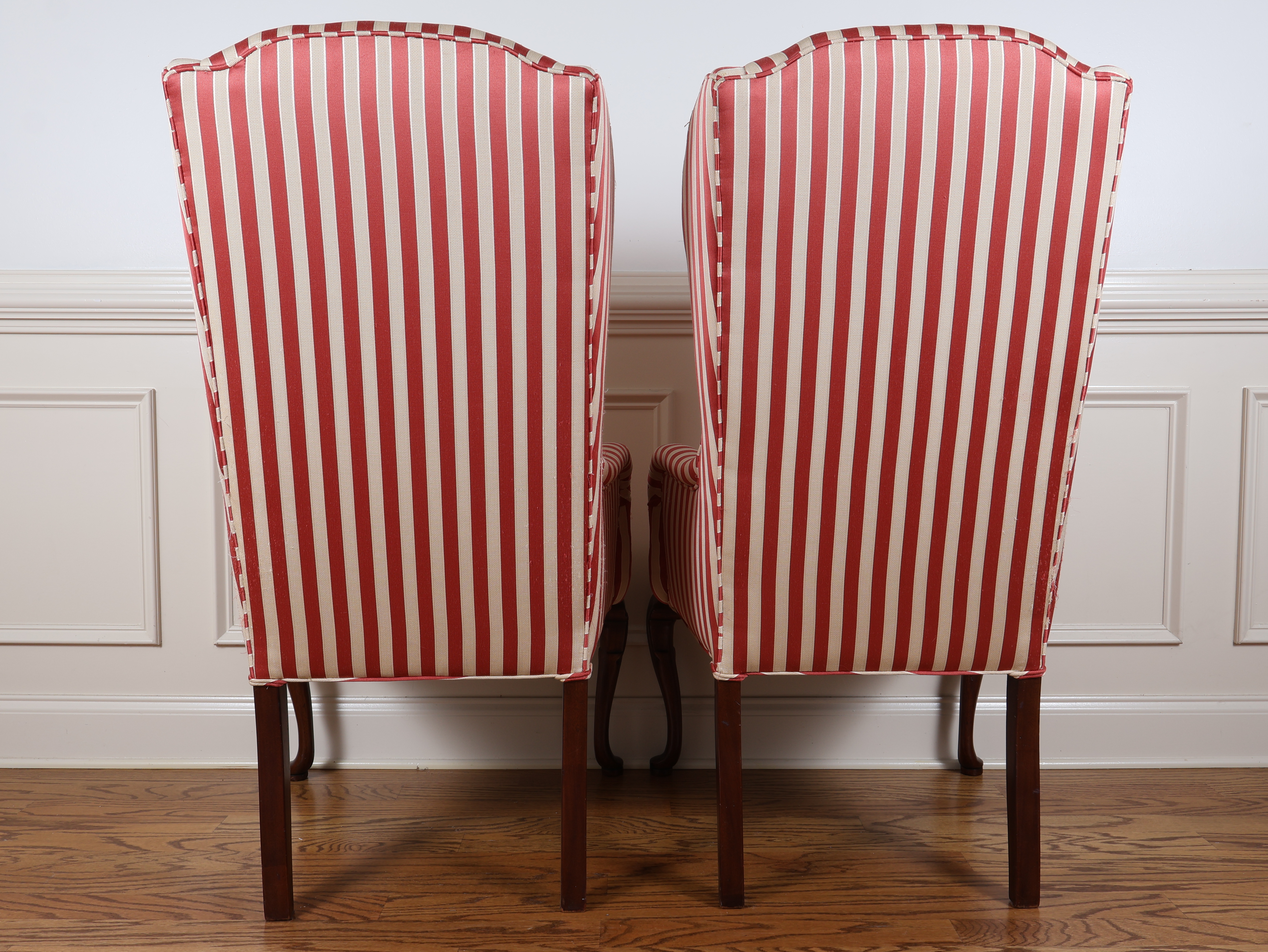 A Pair of Queen Anne Style Wingback Armchairs with Striped Upholstery