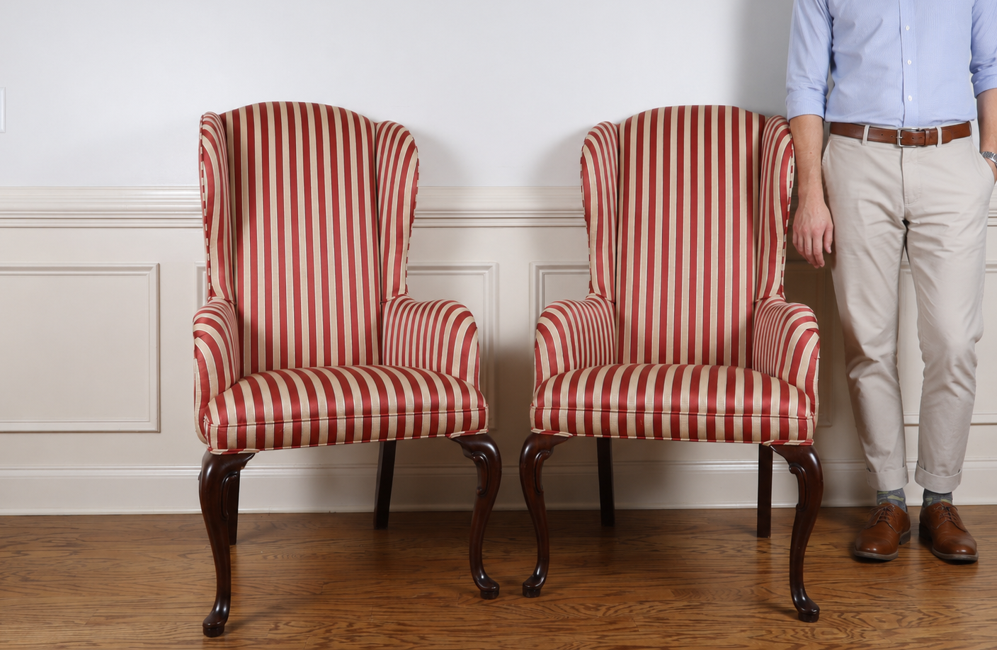 A Pair of Queen Anne Style Wingback Armchairs with Striped Upholstery