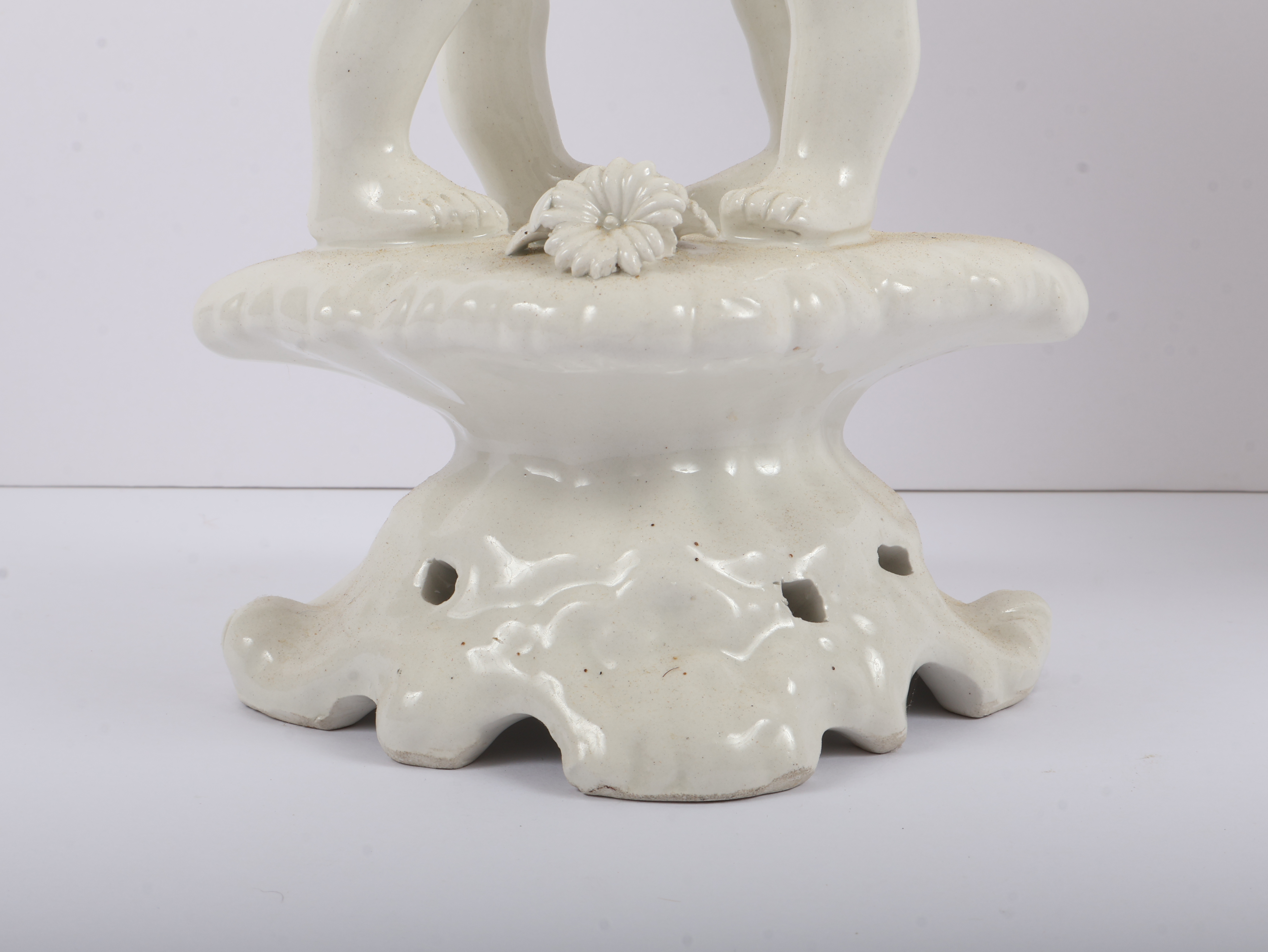 A Pair of Italian White Glazed Porcelain Three-Light Figural Candelabra