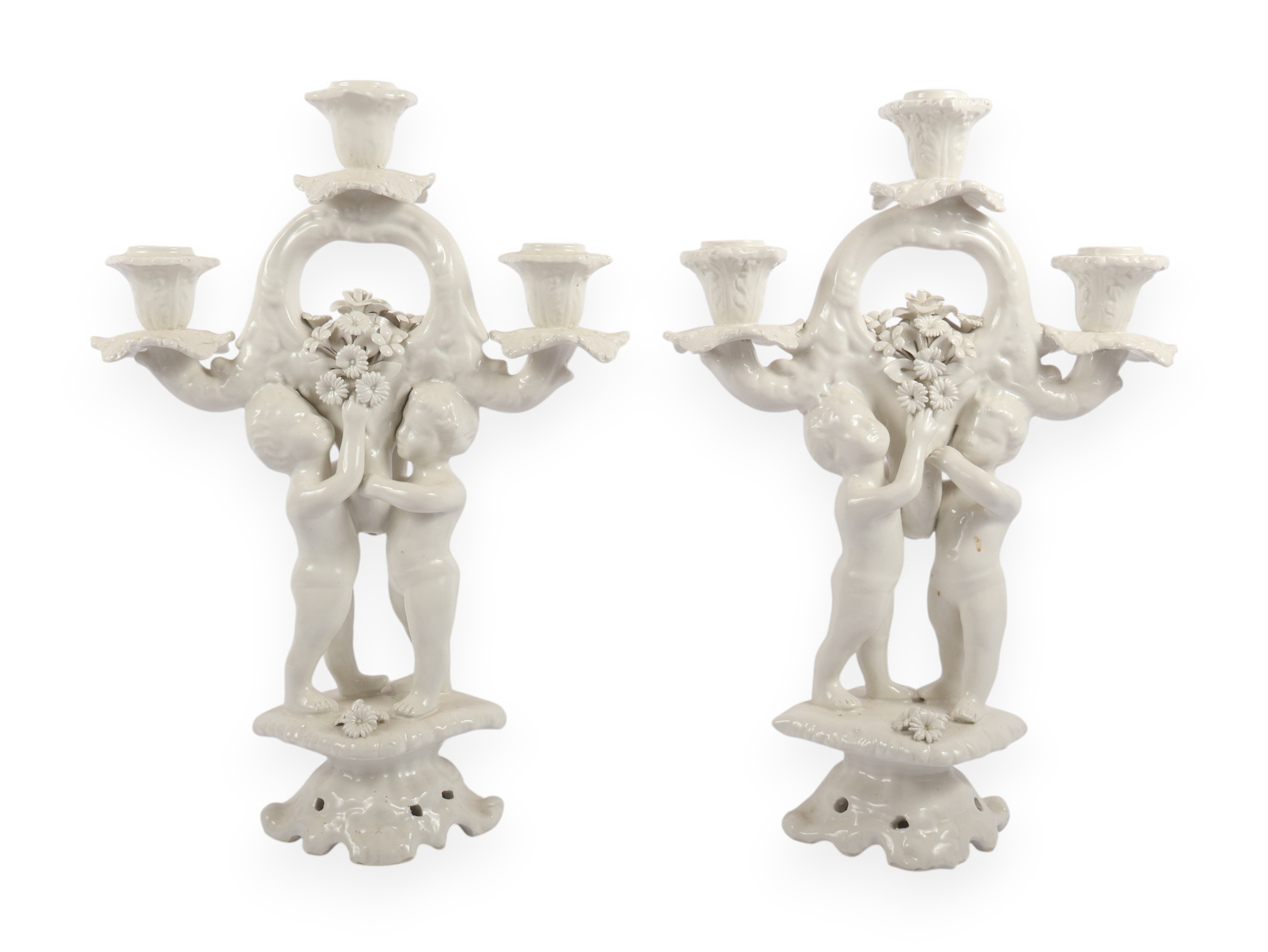 A Pair of Italian White Glazed Porcelain Three-Light Figural Candelabra