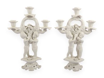A Pair of Italian White Glazed Porcelain Three-Light Figural Candelabra. A pair of Italian white 